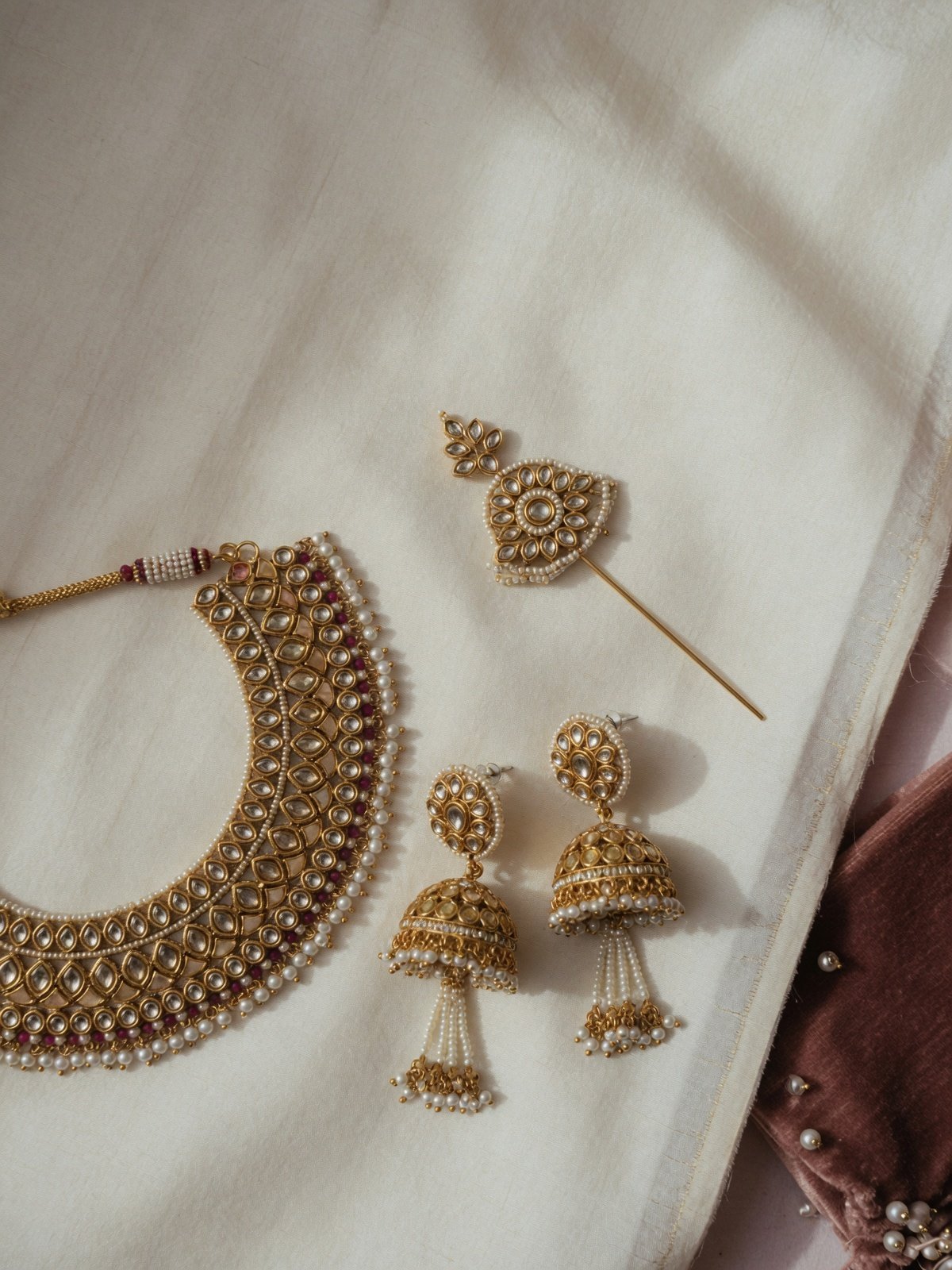 Bridal jewellery on ivory silk
